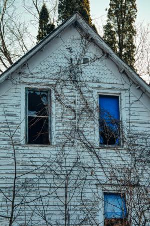 An abandoned home with broken windows